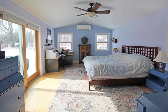 bedroom with lofted ceiling, ceiling fan, wood finished floors, access to outside, and an AC wall unit