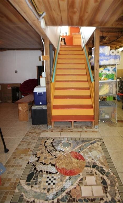 interior space featuring wood ceiling, stairway, and tile patterned floors