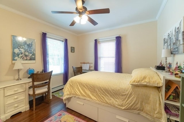 bedroom with wood finished floors, baseboard heating, ornamental molding, a ceiling fan, and a desk