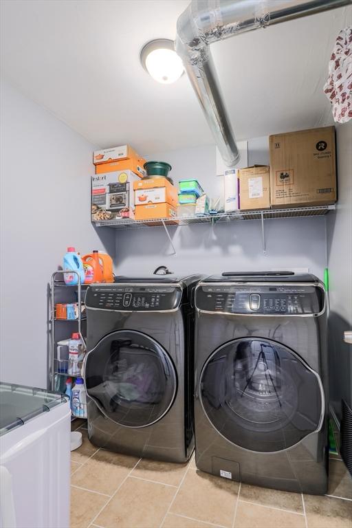 66 Eagle Dr, Dudley, MA 01571 - laundry area featuring washing machine and dryer and tile patterned floors