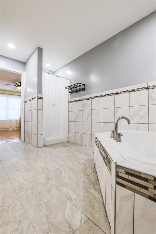66 Eagle Dr, Dudley, MA 01571 - bathroom with a ceiling fan, tile walls, and a shower with curtain