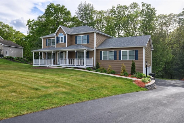 66 Eagle Dr, Dudley, MA 01571 - view of front of house featuring covered porch, asphalt driveway, a front yard, and a shingled roof