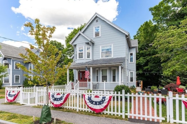 29-31 Bancroft Ave, Reading, MA 01867 - victorian house featuring covered porch, roof with shingles, and a fenced front yard