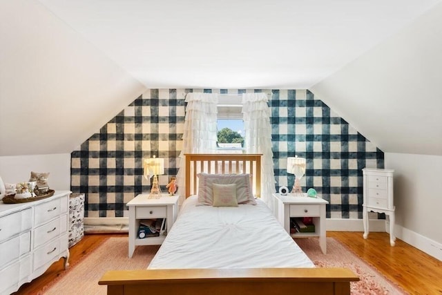29-31 Bancroft Ave, Reading, MA 01867 - bedroom featuring wallpapered walls, wood finished floors, an accent wall, and vaulted ceiling