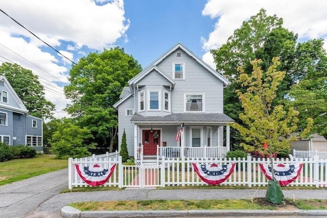 29-31 Bancroft Ave, Reading, MA 01867 - victorian-style house featuring a porch and a fenced front yard