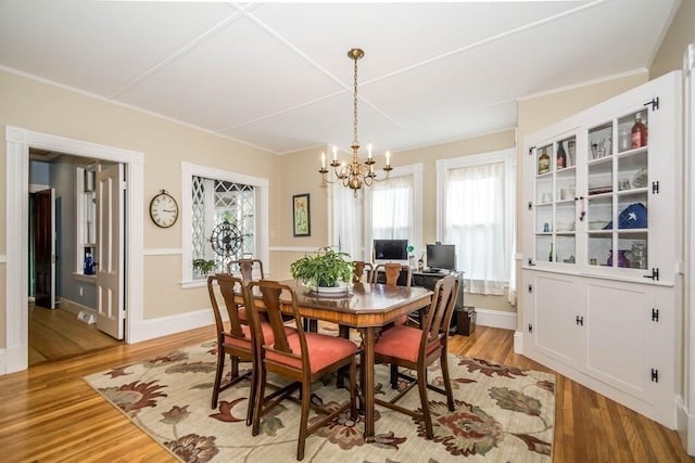 29-31 Bancroft Ave, Reading, MA 01867 - dining area with a chandelier, healthy amount of natural light, light wood-type flooring, and ornamental molding