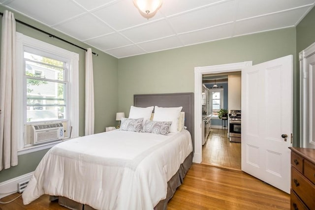 29-31 Bancroft Ave, Reading, MA 01867 - bedroom with wood finished floors, multiple windows, and cooling unit