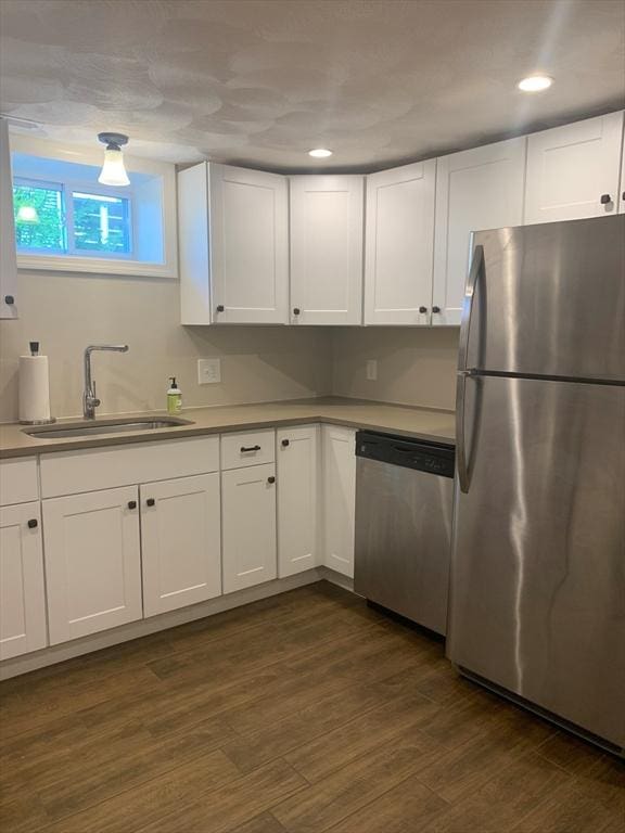 29-31 Bancroft Ave, Reading, MA 01867 - kitchen featuring appliances with stainless steel finishes, white cabinetry, dark wood-style flooring, and recessed lighting