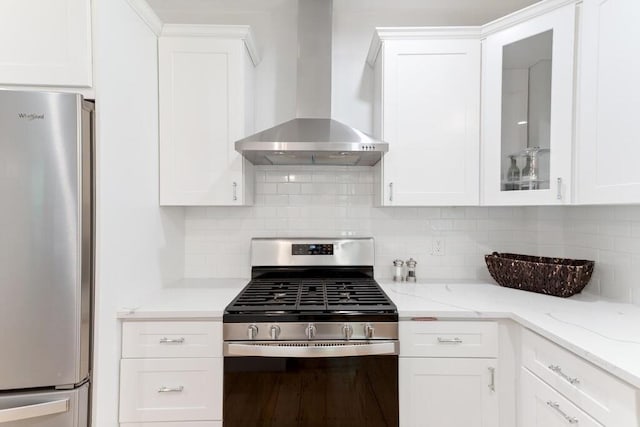 29-31 Bancroft Ave, Reading, MA 01867 - kitchen with stainless steel appliances, wall chimney range hood, white cabinets, tasteful backsplash, and glass insert cabinets