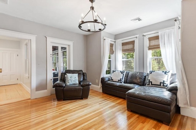 29-31 Bancroft Ave, Reading, MA 01867 - living area featuring a chandelier and light wood-style flooring