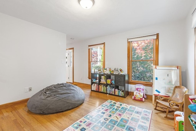 game room with hardwood / wood-style floors