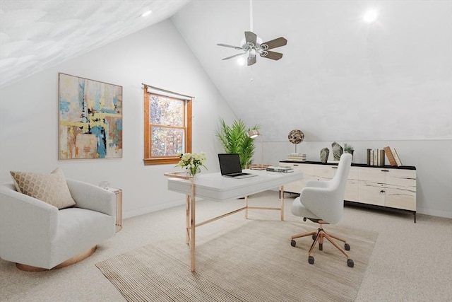 office area featuring light colored carpet, ceiling fan, and lofted ceiling