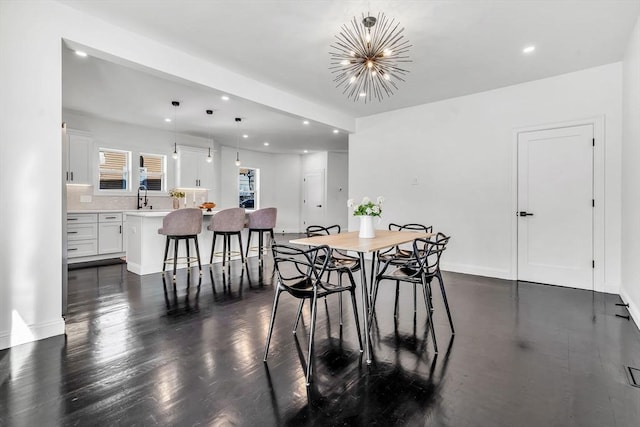 dining area with recessed lighting, a chandelier, dark wood finished floors, and baseboards