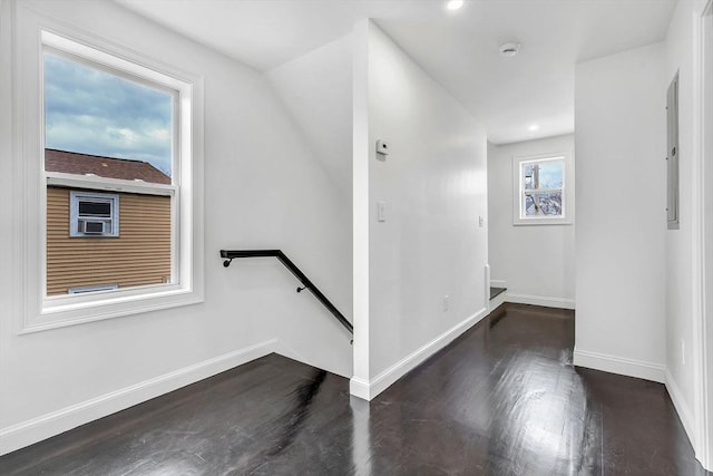 foyer with wood finished floors, baseboards, and recessed lighting