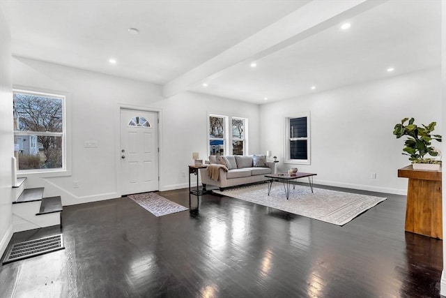 living area with wood finished floors, baseboards, recessed lighting, and beam ceiling