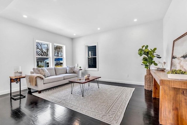 living area featuring baseboards, recessed lighting, and dark wood finished floors