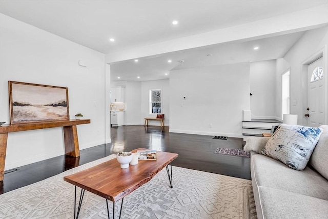 living area with wood finished floors, recessed lighting, and baseboards