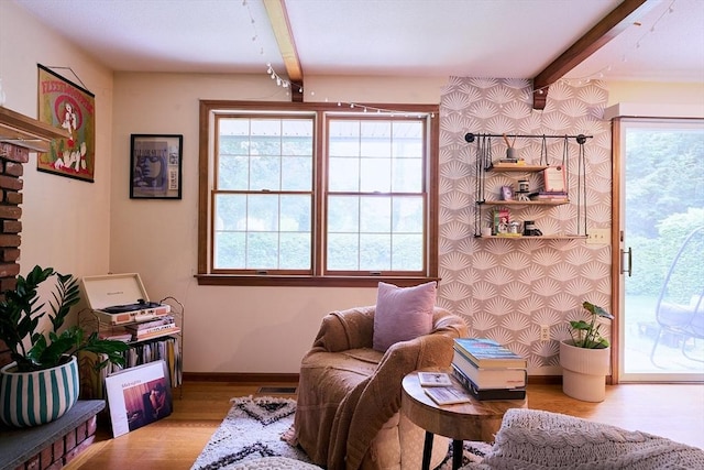 19 Hadley St Unit 14, South Hadley, MA 01075 - living area with beam ceiling, wood finished floors, and baseboards