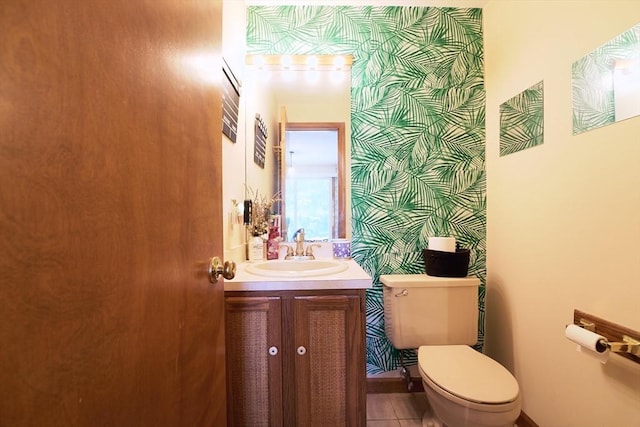 19 Hadley St Unit 14, South Hadley, MA 01075 - bathroom with toilet, vanity, wallpapered walls, and tile patterned flooring