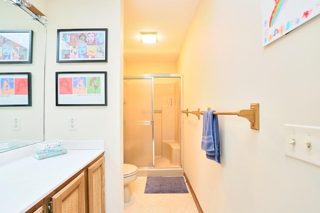19 Hadley St Unit 14, South Hadley, MA 01075 - bathroom with a shower stall, toilet, vanity, and baseboards
