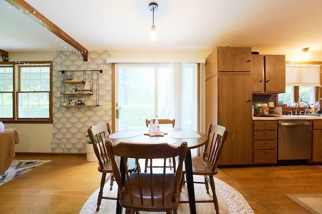 19 Hadley St Unit 14, South Hadley, MA 01075 - dining room featuring light wood-type flooring, baseboards, and beam ceiling