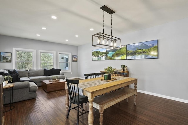 dining room with recessed lighting, baseboards, and dark wood-style floors