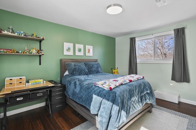 bedroom featuring dark wood finished floors, visible vents, and baseboards