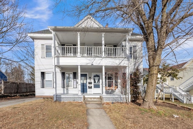 view of front of home featuring a porch and a balcony