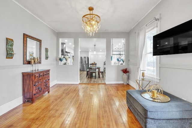 interior space with a chandelier and hardwood / wood-style flooring