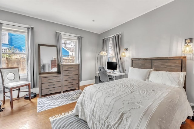 bedroom with light hardwood / wood-style flooring