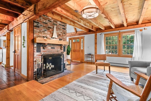 living room featuring hardwood / wood-style floors, beamed ceiling, a baseboard radiator, and wooden ceiling