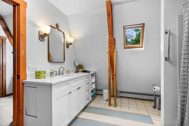 bathroom with vanity, a baseboard heating unit, and tile patterned floors