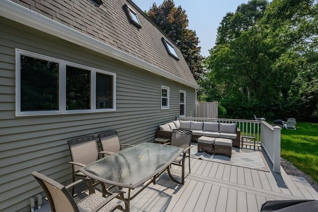 wooden terrace with outdoor dining area and outdoor lounge area