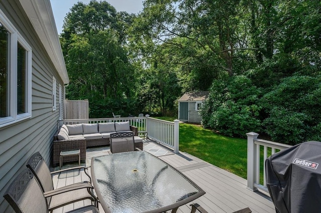 deck featuring grilling area, a yard, outdoor dining area, an outdoor structure, and an outdoor living space