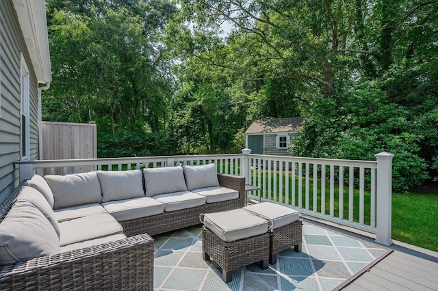 deck featuring an outdoor hangout area, a yard, and an outdoor structure