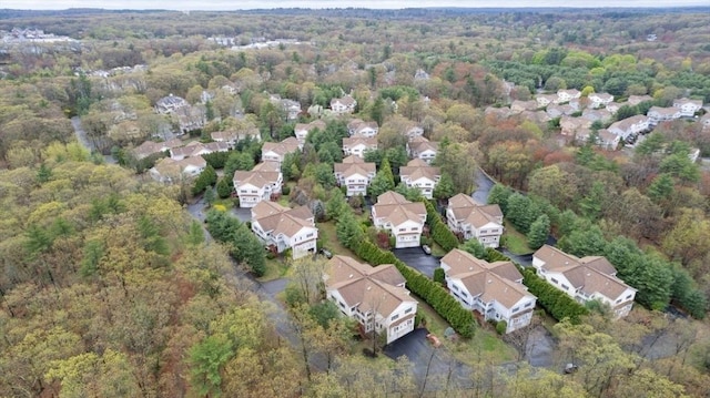 drone / aerial view with a view of trees and a residential view