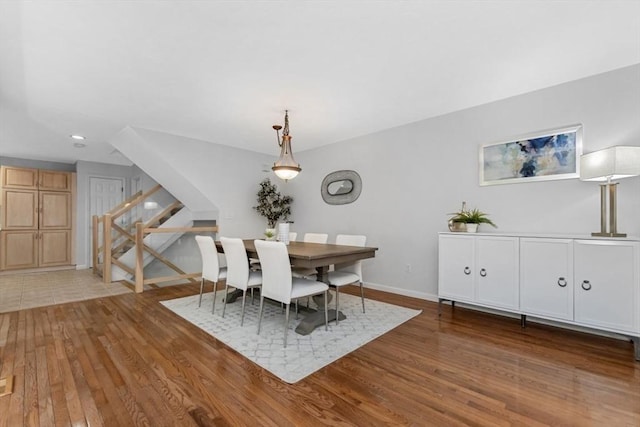 dining room featuring recessed lighting, baseboards, and wood finished floors