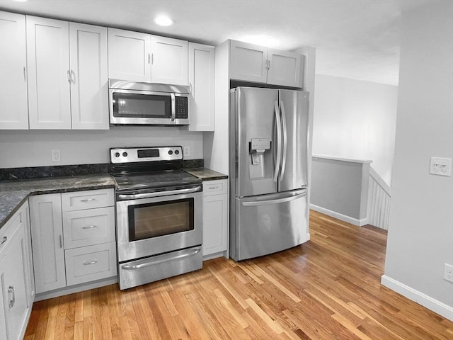 7 Nirvana Dr, Saugus, MA 01906 - kitchen with appliances with stainless steel finishes, light wood-type flooring, baseboards, and recessed lighting