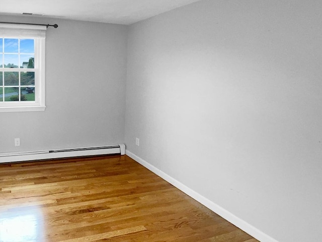 7 Nirvana Dr, Saugus, MA 01906 - unfurnished room with wood finished floors, baseboard heating, and baseboards
