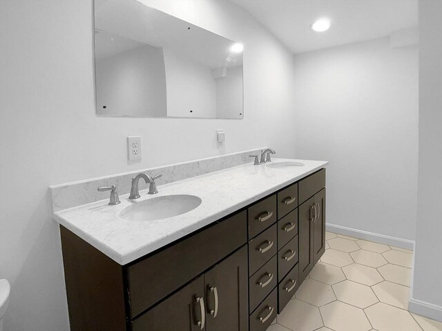 7 Nirvana Dr, Saugus, MA 01906 - full bath with double vanity, tile patterned floors, and baseboards