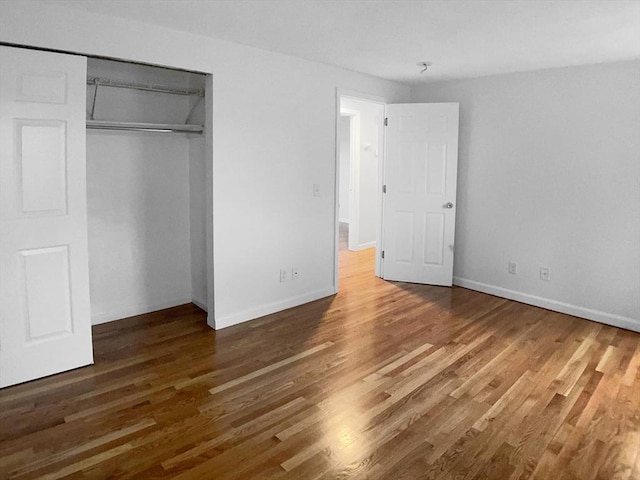 7 Nirvana Dr, Saugus, MA 01906 - unfurnished bedroom featuring wood finished floors, a closet, and baseboards