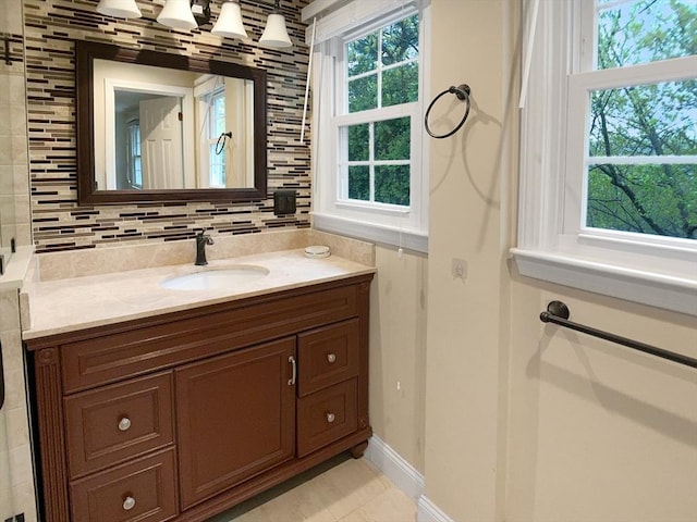 7 Nirvana Dr, Saugus, MA 01906 - bathroom featuring plenty of natural light, vanity, and baseboards