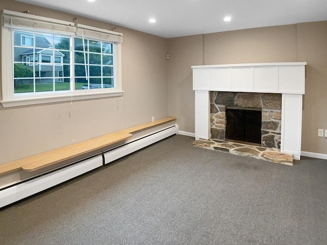 7 Nirvana Dr, Saugus, MA 01906 - unfurnished living room with a baseboard radiator, a stone fireplace, baseboards, carpet flooring, and recessed lighting