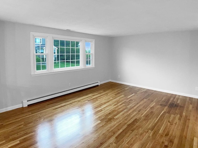 7 Nirvana Dr, Saugus, MA 01906 - spare room featuring a baseboard heating unit, wood finished floors, and baseboards