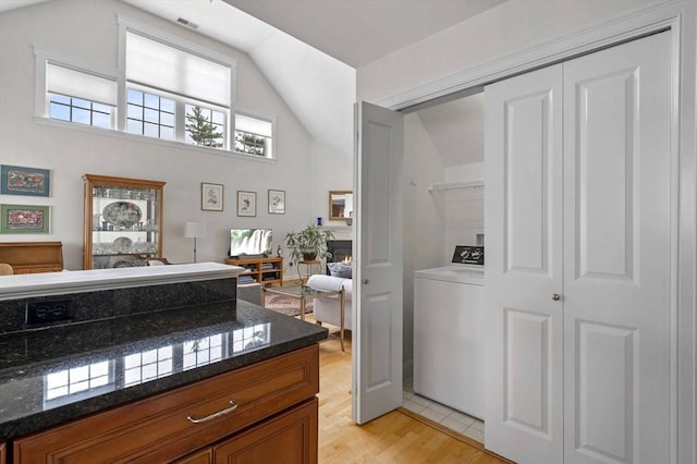 6 Essex Rd Unit 15, Ipswich, MA 01938 - interior space with washer / dryer, visible vents, wood finished floors, and lofted ceiling