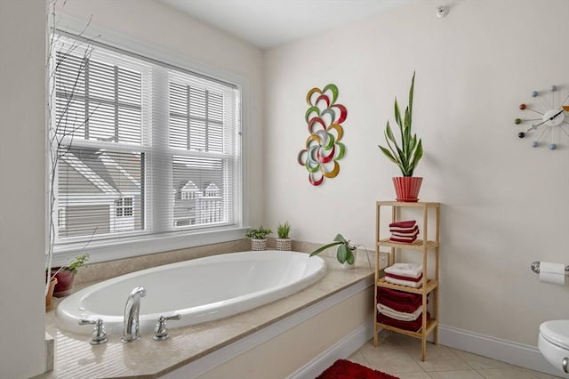 6 Essex Rd Unit 15, Ipswich, MA 01938 - bathroom featuring toilet, tile patterned floors, baseboards, and a bath