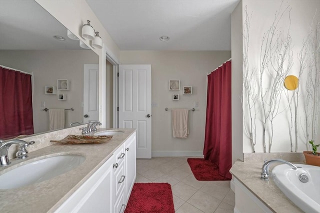 6 Essex Rd Unit 15, Ipswich, MA 01938 - full bath featuring a sink, tile patterned flooring, double vanity, and a bath