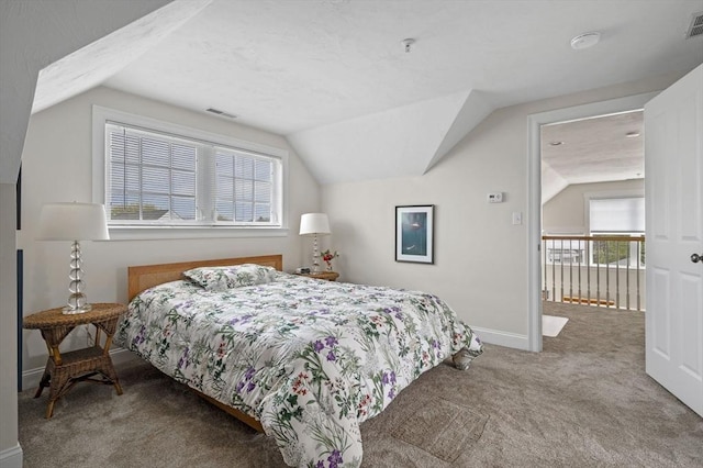 6 Essex Rd Unit 15, Ipswich, MA 01938 - carpeted bedroom with baseboards, lofted ceiling, and multiple windows