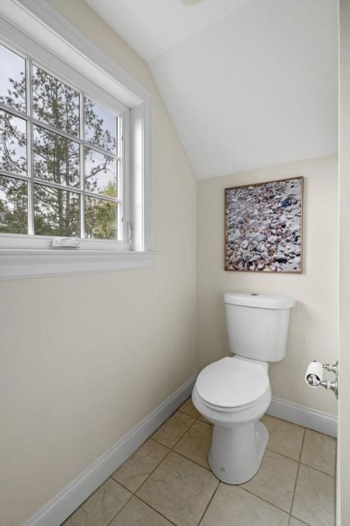 6 Essex Rd Unit 15, Ipswich, MA 01938 - bathroom with baseboards, tile patterned flooring, toilet, and lofted ceiling