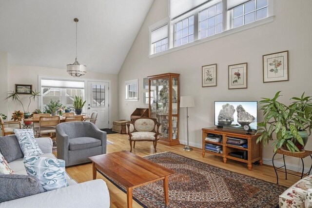 6 Essex Rd Unit 15, Ipswich, MA 01938 - living area with high vaulted ceiling and wood finished floors